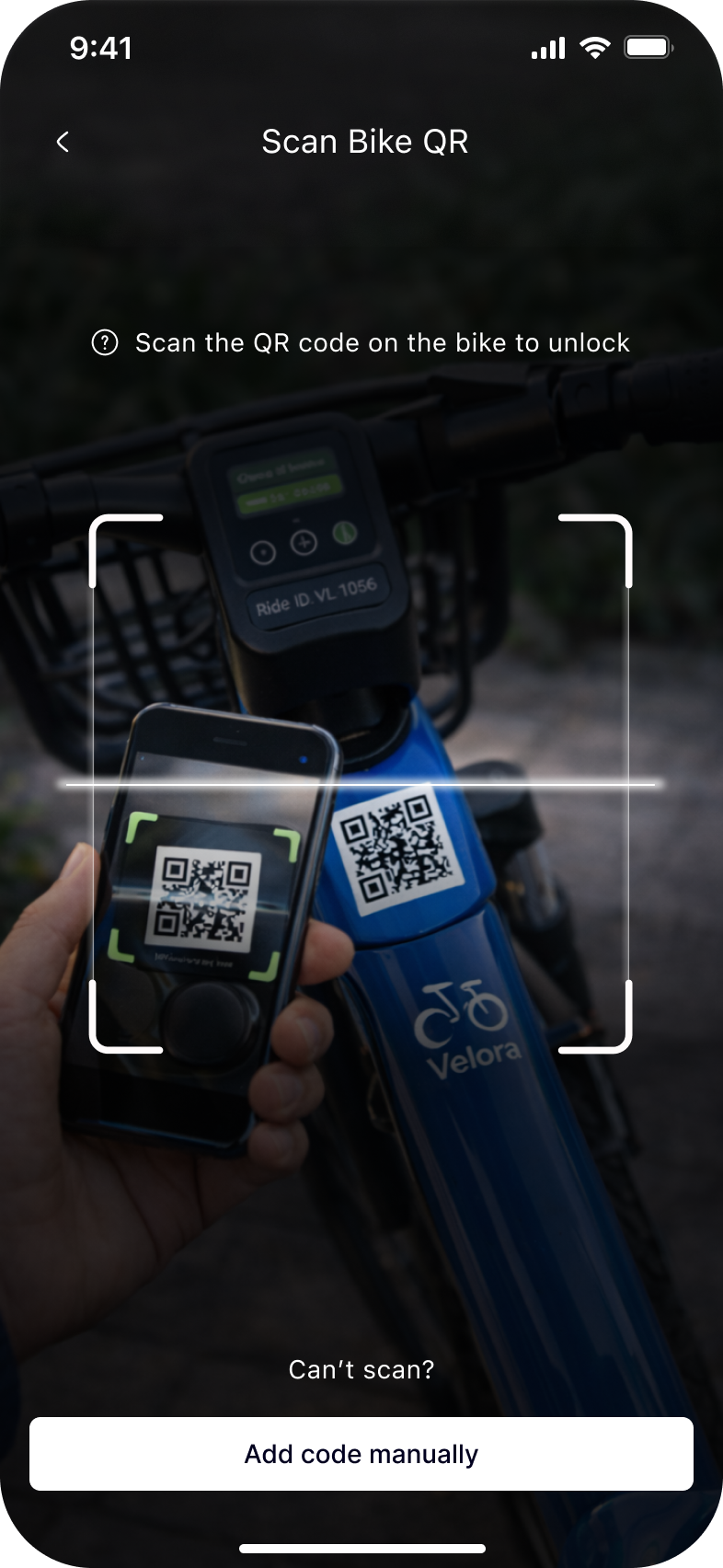 Scanning the QR code on the bike to unlock it